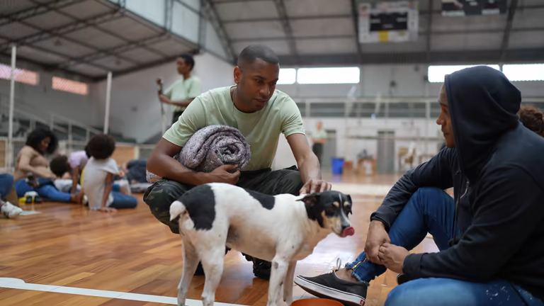 pet-care business owner and dog in an emergency shelter