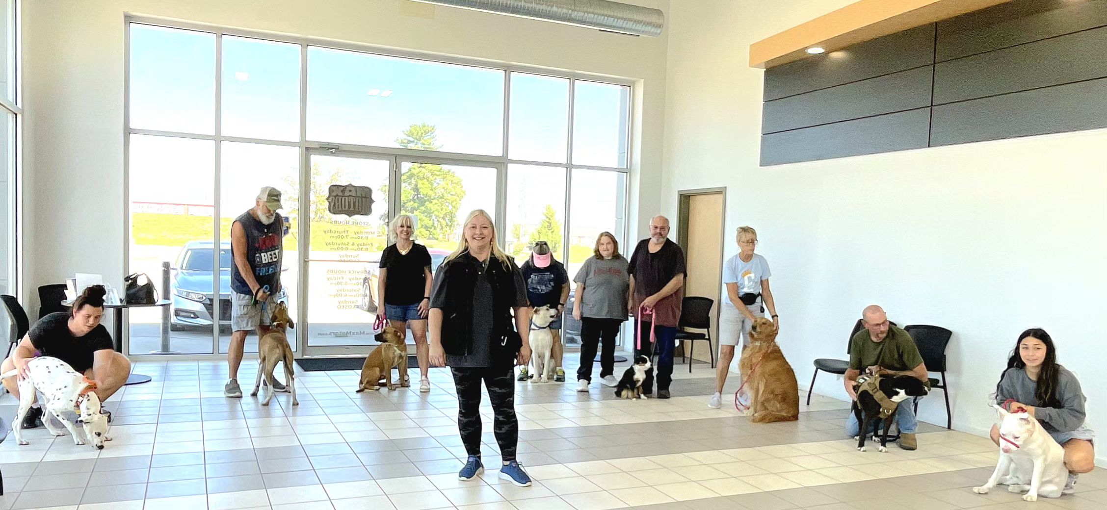 Dalmatia BnB team inside their business with dogs 