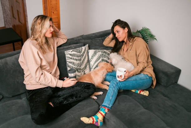 two dog lovers having a heart-to-heart talk over coffee
