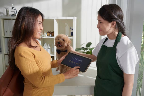 client leaving groomer a positive review on a tablet
