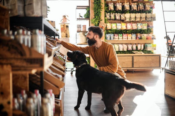 A Young Man and His dog at the Pet Shop