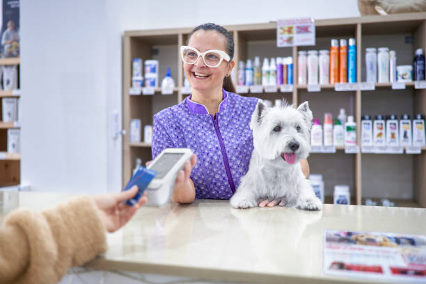 person paying after a dog grooming appointment