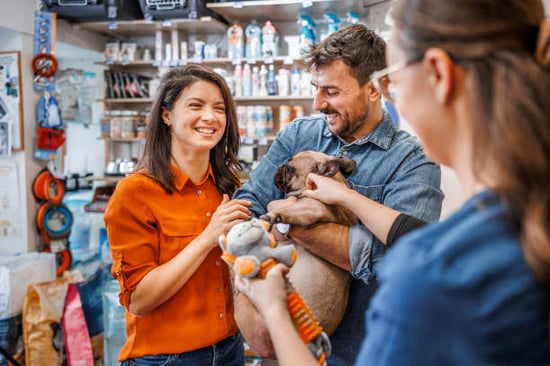People talk inside a pet business store