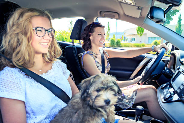 happy family picking up dog from appointment