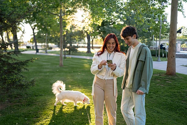 dog trainer showing pet parent app features