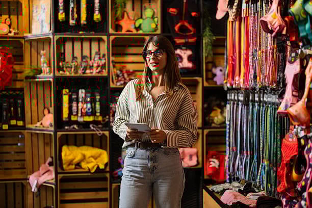 pet-care business owner getting branding ideas in pet shop