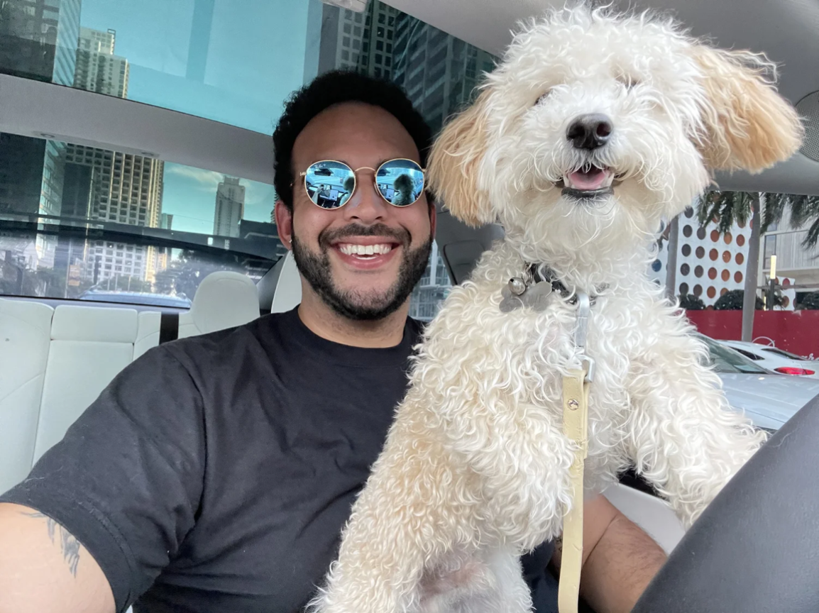 Home Sweet Home Owner Paris Guinn smiling with a dog
